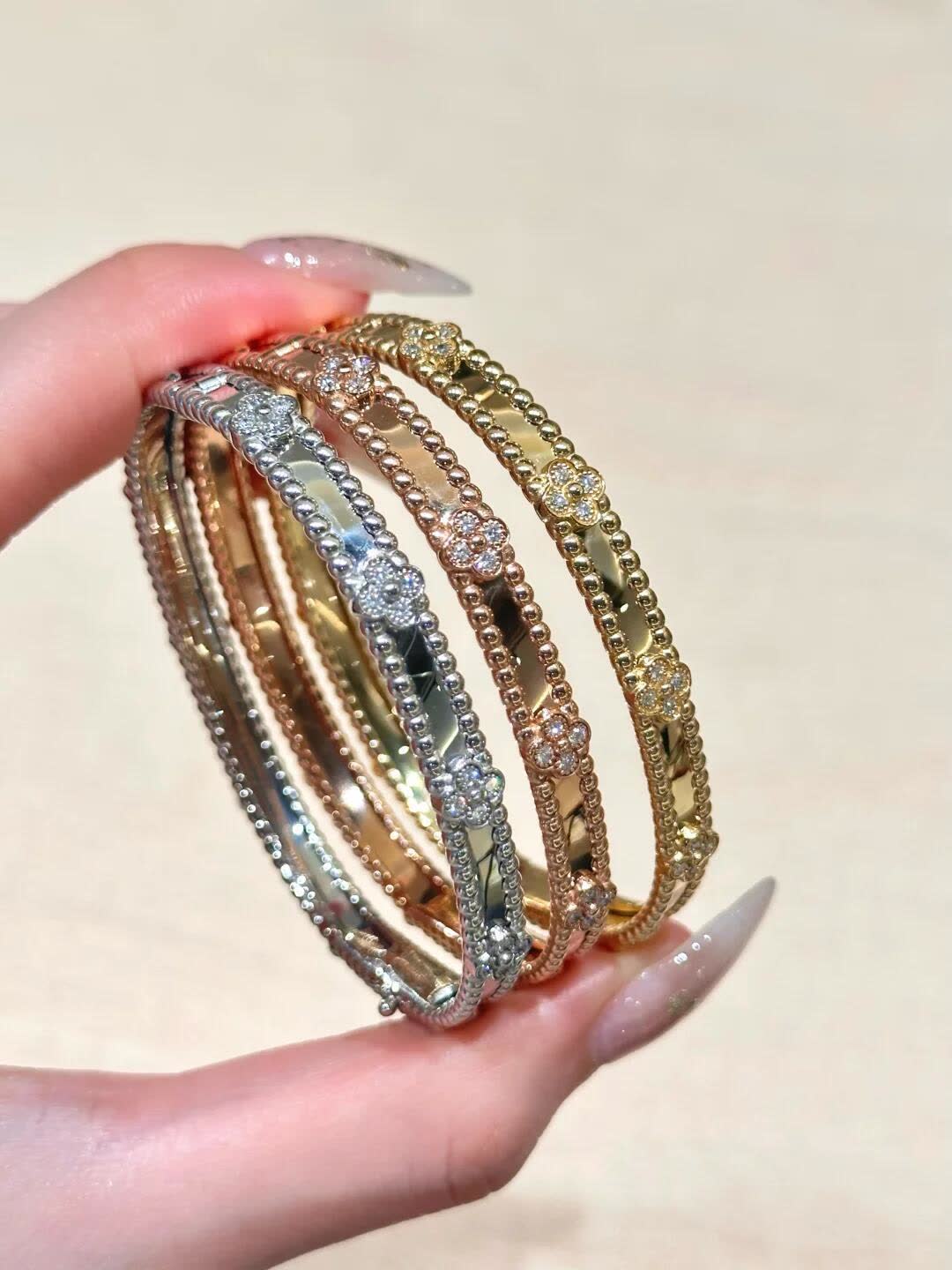 Van Cleef & Arpels Elegant Gold and Silver Bracelets Set